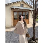 An elegant and stylish two-piece cape set